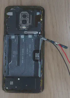 BMS circuit connected to a OnePlus 6T smartphone